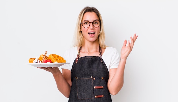 happy cook showing a plated dish